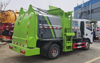 Barreled garbage collection truck